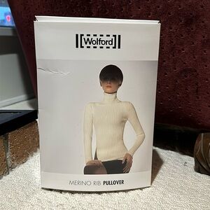 WOLFORD- SIZE medium merino rib turtleneck pullover.